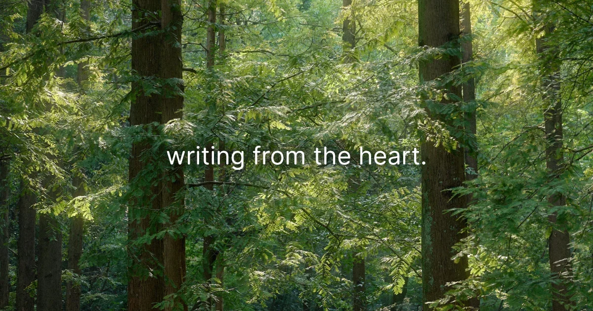 Sunlight filtering through a dense green forest, with the words “writing from the heart.”
